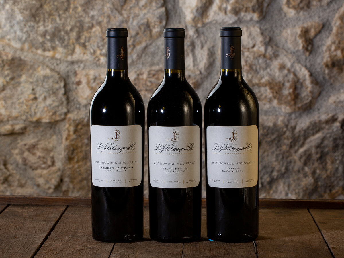 Three bottles of La Jota Vineyard wine lined up on a table